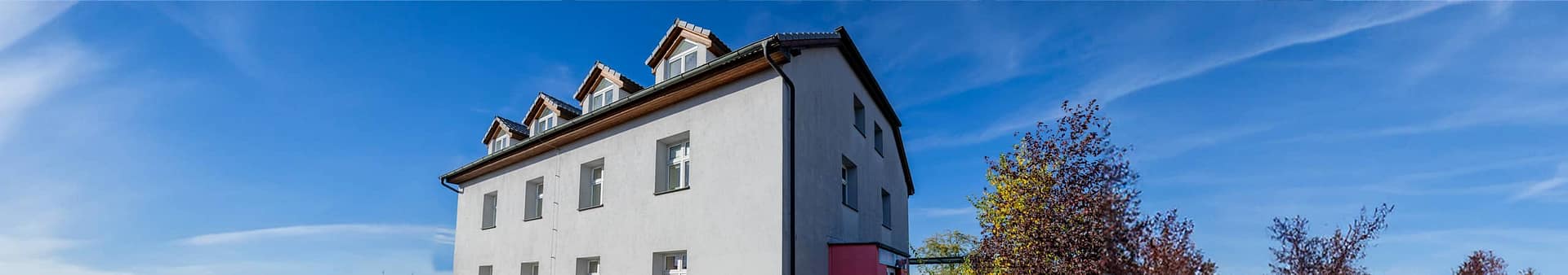 Traductera - budova firmy baner